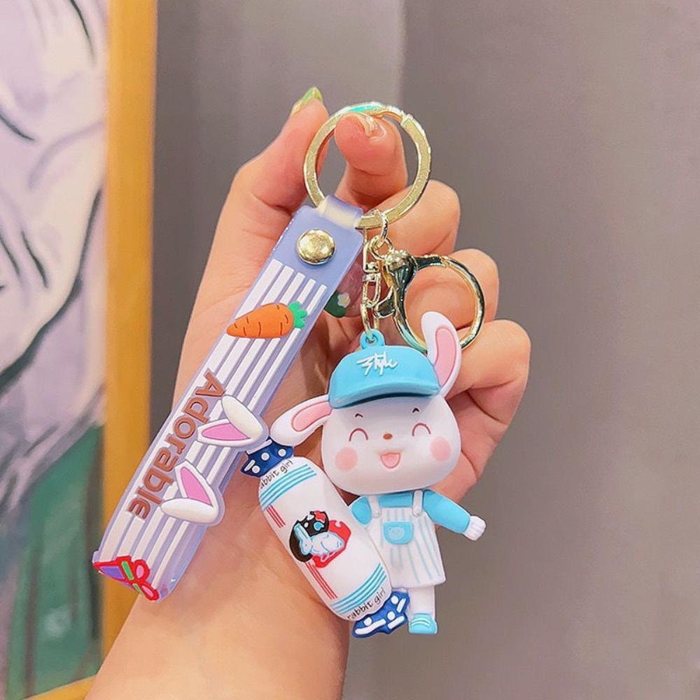 móc khóa thỏ xanh cầm kẹo  - dây dài 11cm mô hình cao 7.5cm - nặng : 50gram - boc túi - no box n3-k17-t5-s3