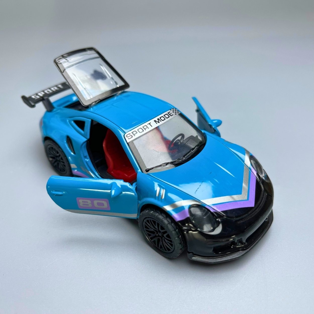 Mô Hình xe Porsche 911 màu xanh trời vạch tím đen - tỉ lệ 1:36 Hợp kim có thể mở cửa - bánh sau chạy cót - Dài 12cm - rộng 5cm - cao 3.5cm - nặng : 200gram - FULL BOX : box màu - OTO81 - N3-K3-T4-S2