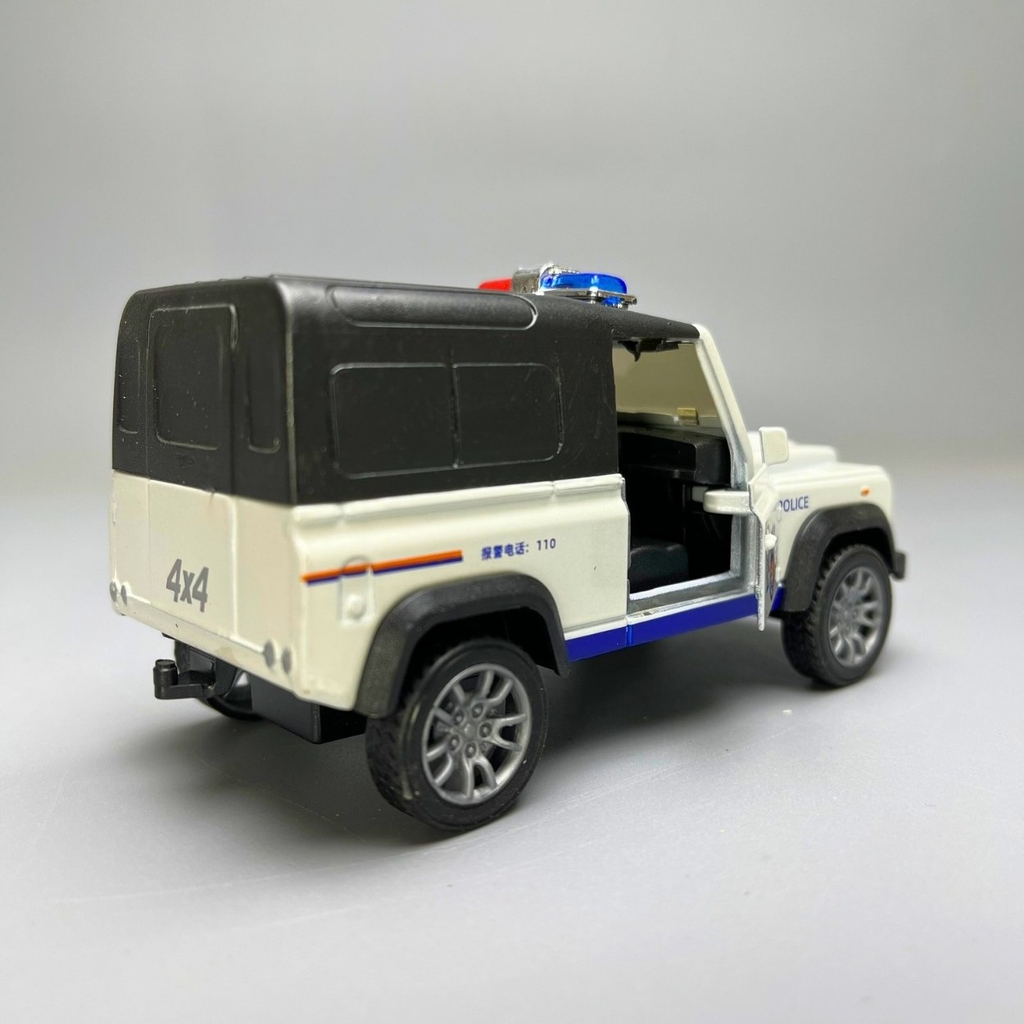 Mô Hình xe JEEP thùng Police màu trắng - tỉ lệ 1:36 Hợp kim có thể mở cửa - bánh sau chạy cót - Dài 11cm - rộng 5cm - cao 4cm - nặng : 200gram - FULL BOX : box màu