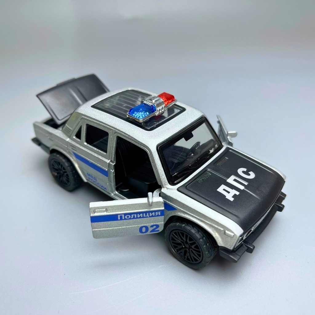Mô Hình xe oto Police màu xám - tỉ lệ 1:36 Hợp kim có thể mở cửa - bánh sau chạy cót - Có tiếng - đèn pha sáng - Dài 12cm - rộng 5cm - cao 4cm - nặng : 200gram - FULL BOX : box màu