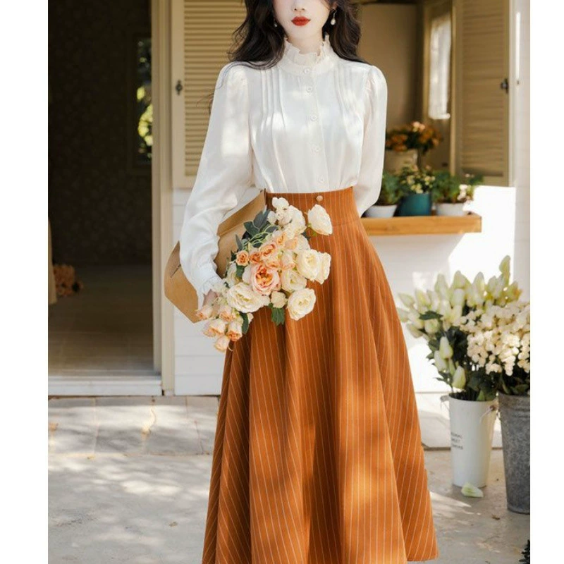 Đầm hai dây màu cam kẻ sọc trắng phối áo sơ mi phong cách Nữ thần D547240