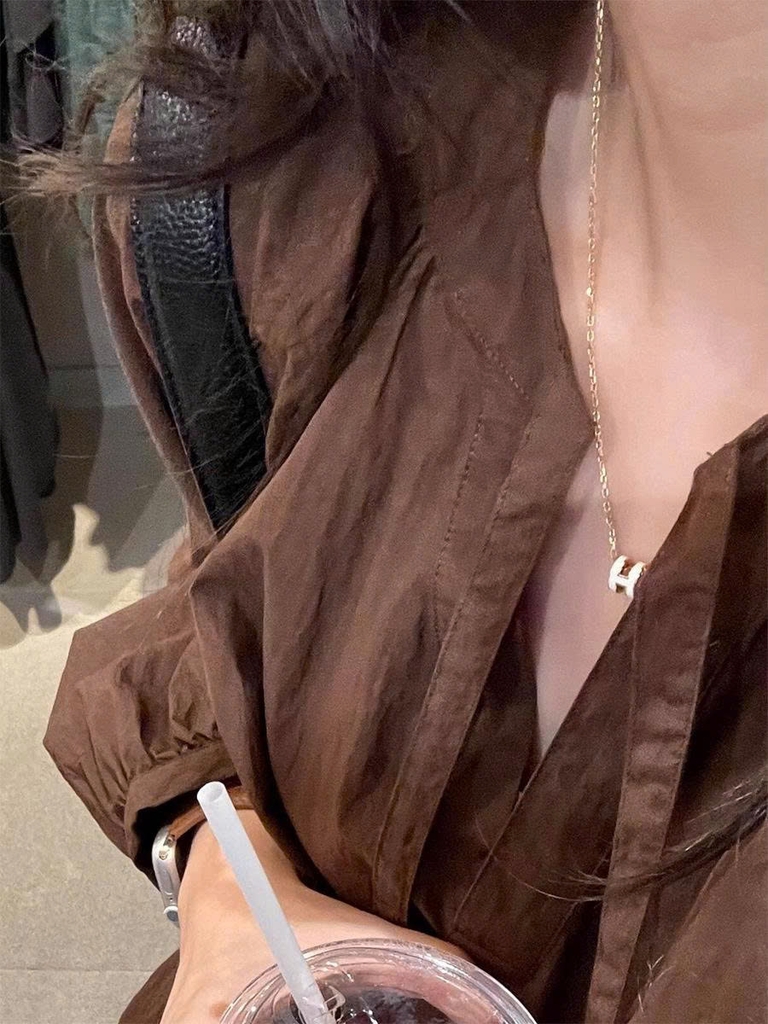 Áo sơ mi nâu nữ xuân thu 2025 dáng rộng thoải mái D237250