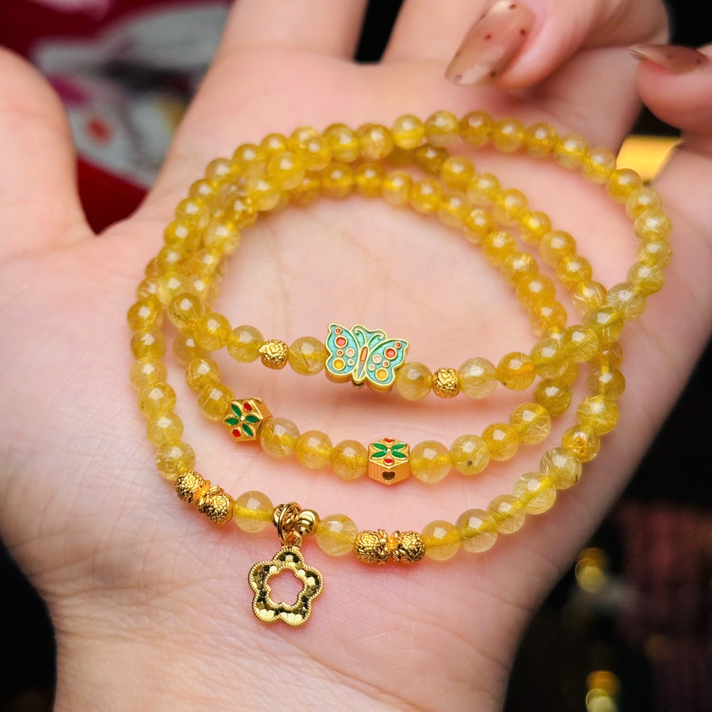 Thạch anh tóc vàng 5li mix charm bạc mạ