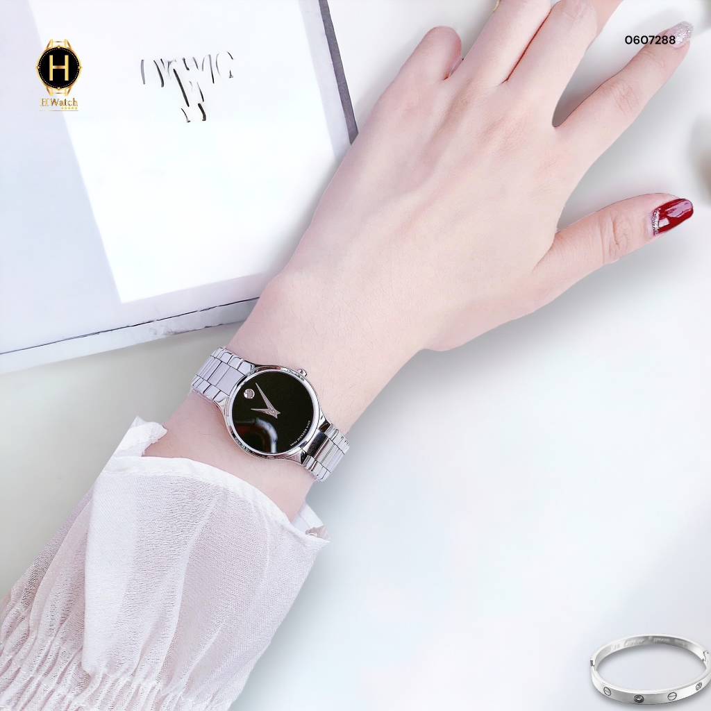 Đồng Hồ Nữ Movado Quartz 0607288 Dây Thép Trắng Mặt Đen.
