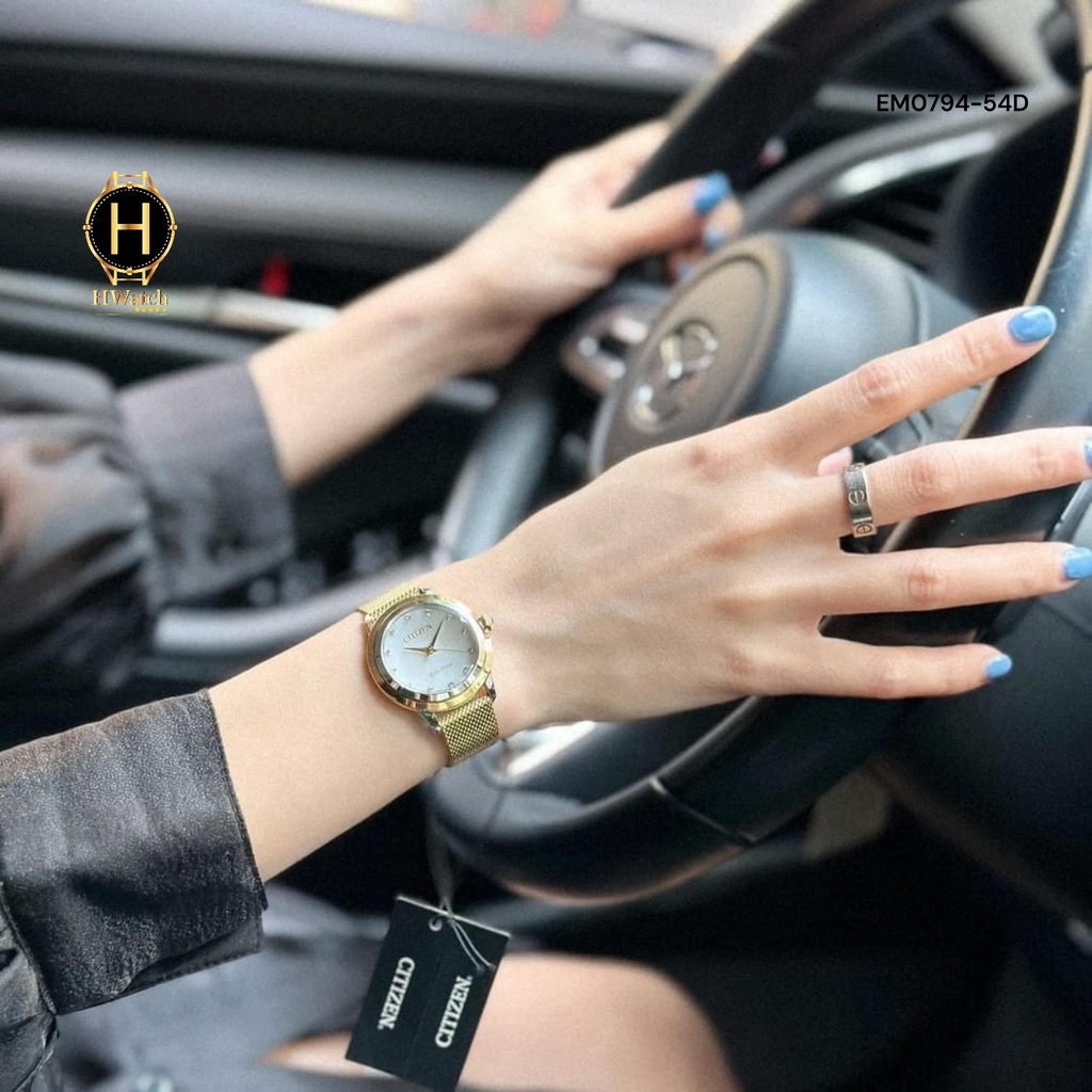Đồng Hồ Nữ Citizen Quartz Eco-Drive EM0794-54D Dây Thép Vàng Mặt Trắng Xà Cừ
