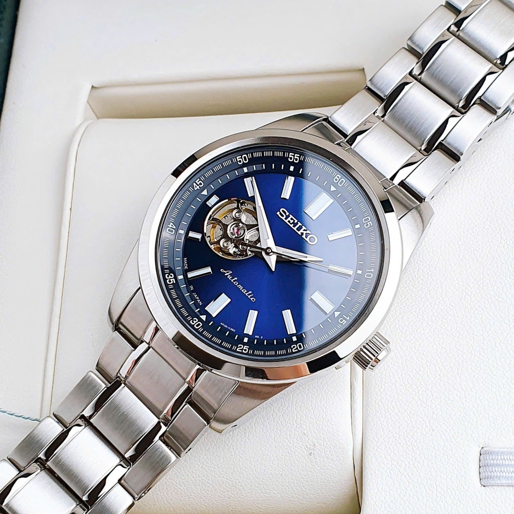 Đồng Hồ Nam Seiko Automatic Open Heart SCVE051 Dây Thép Vỏ Trắng Mặt Xanh