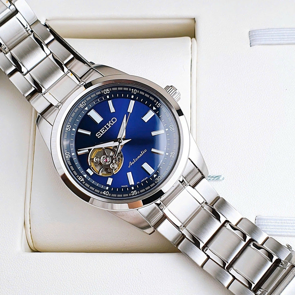 Đồng Hồ Nam Seiko Automatic Open Heart SCVE051 Dây Thép Vỏ Trắng Mặt Xanh