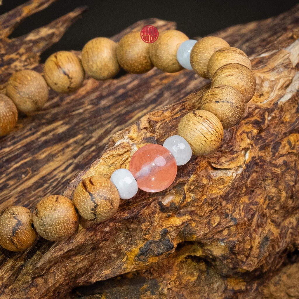 Vòng trầm hương tròn banh đỏ 8 li mix ngọc hồng