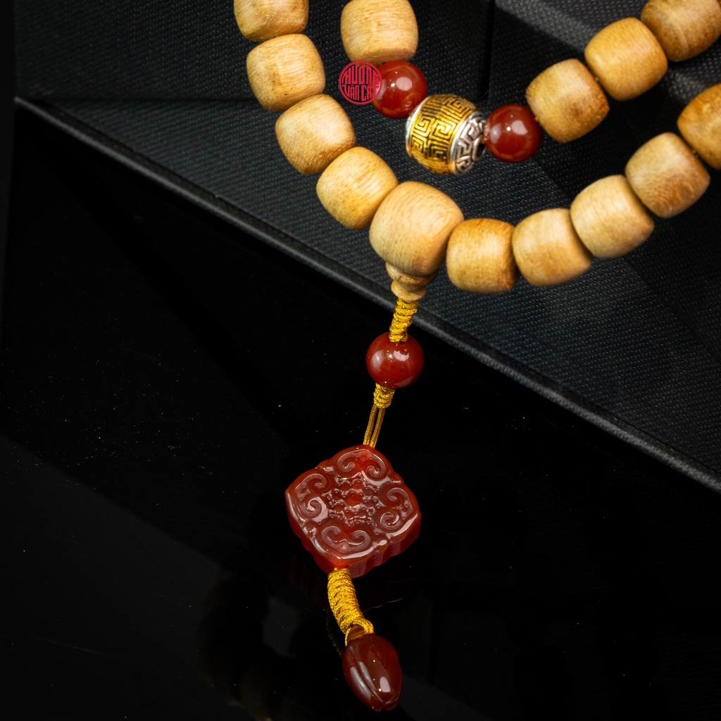 Chuỗi trầm hương Niệm Phật 108 hạt 10 li banh mix đá đỏ