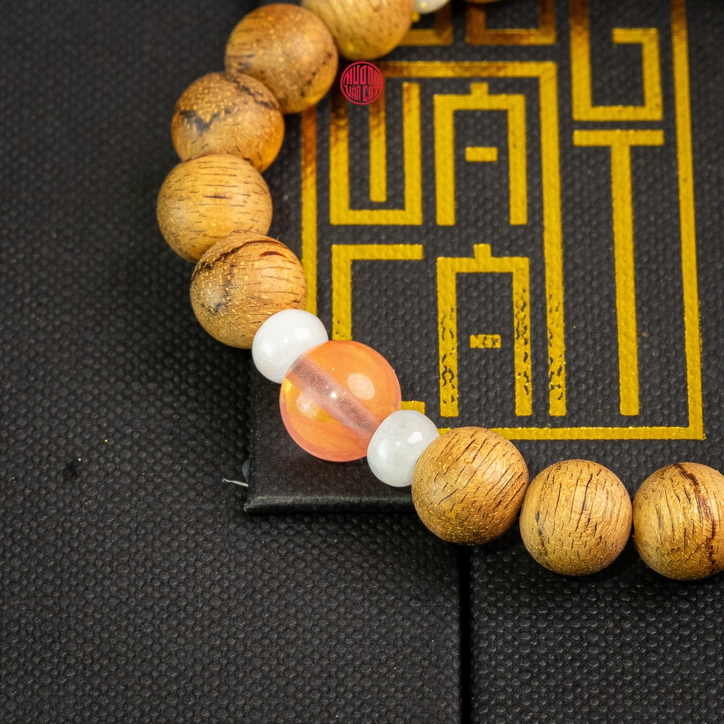 Vòng trầm hương tròn banh đỏ 8 li mix ngọc hồng