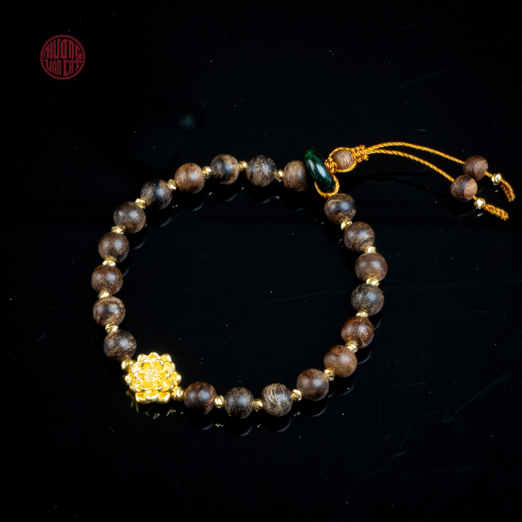Vòng tay Trầm Hương nữ cận chìm 6 li mix charm Vàng ( kiểu 2 )