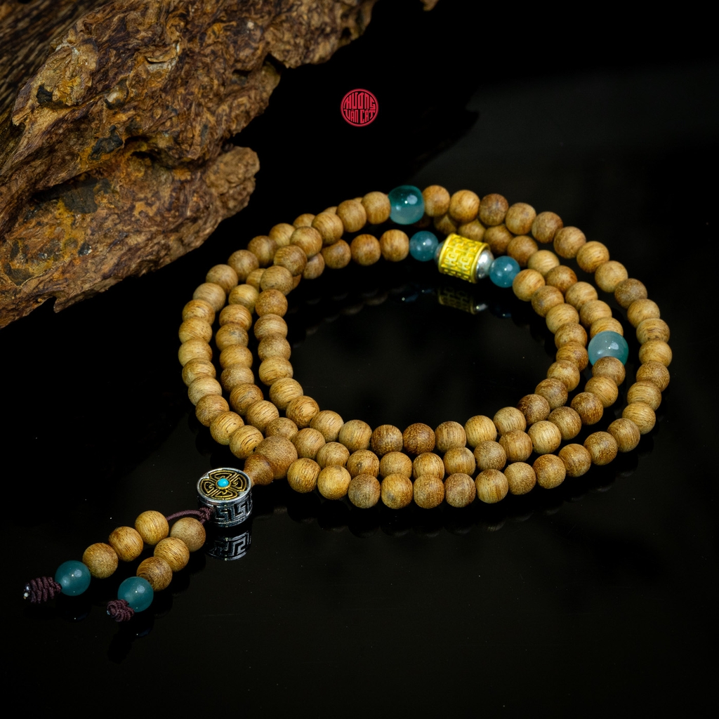 Chuỗi trầm hương 108 hạt 6 li banh mix đá và charm bạc