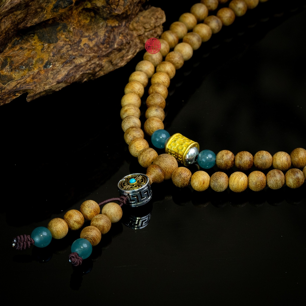 Chuỗi trầm hương 108 hạt 6 li banh mix đá và charm bạc