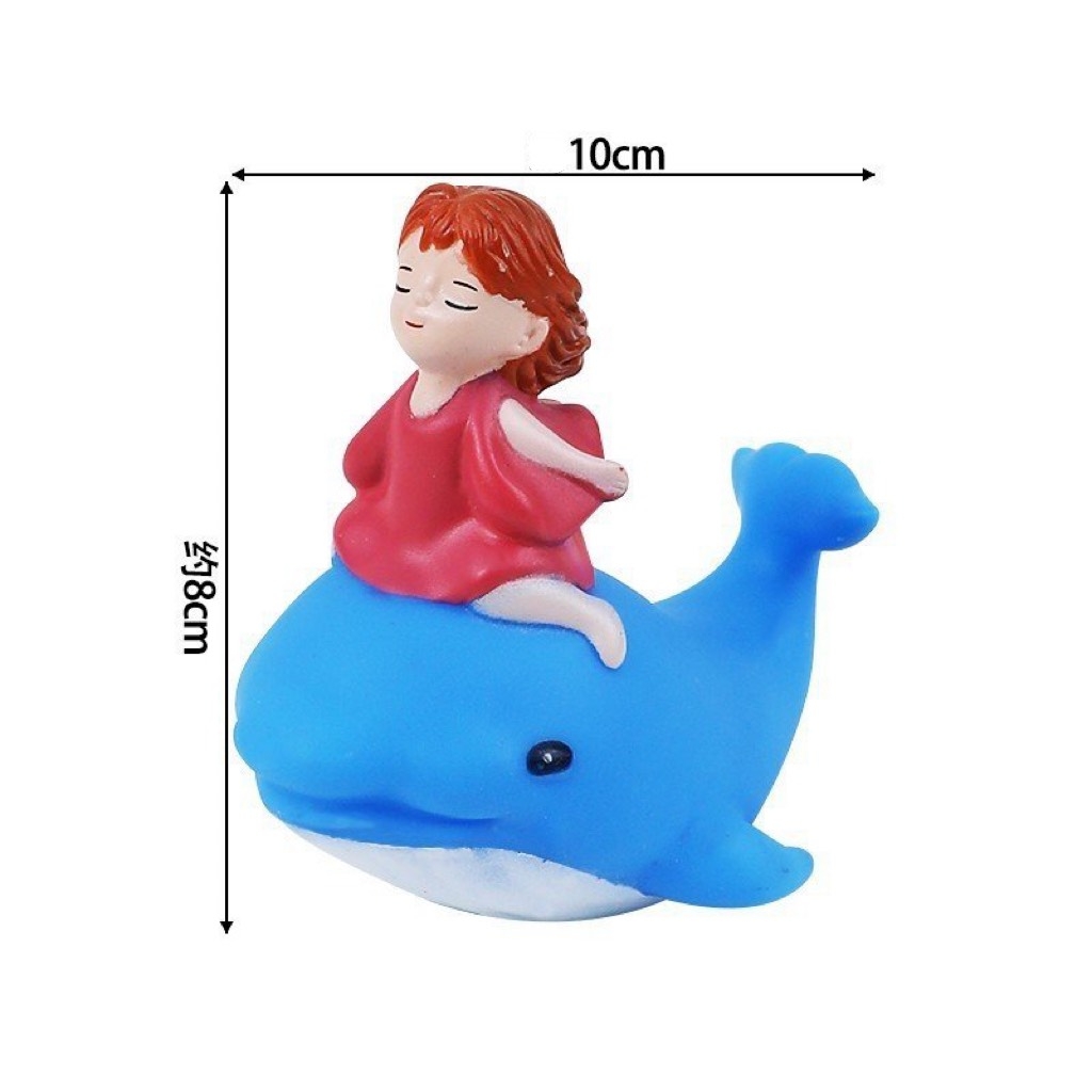 Bé gái ngồi cá voi