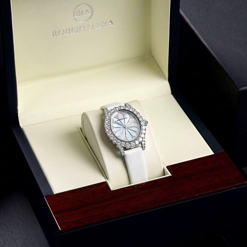 Đồng Hồ Nữ Roberto Era Dây Da Lụa Trắng Mặt Oval Họa Tiết 12 Cánh Hoa Size 33mm Viền Đá Silver RE2201