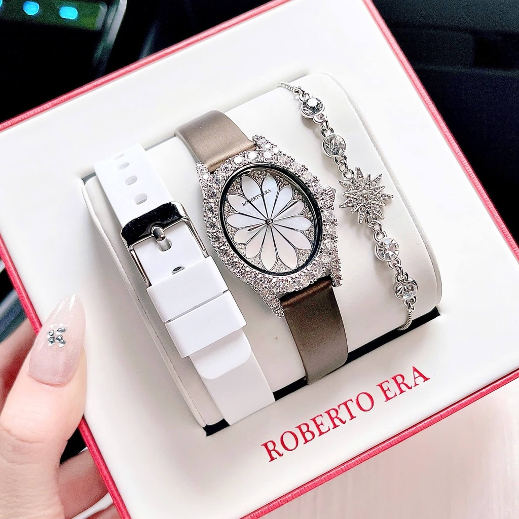 Set Đồng Hồ Nữ Roberto Era Dây Da Lụa Nâu Mặt Oval Họa Tiết 12 Cánh Hoa Size 33mm Viền Đá RE220 Tặng Kèm Bộ Dây Cao Su Trắng Và Vòng Tay