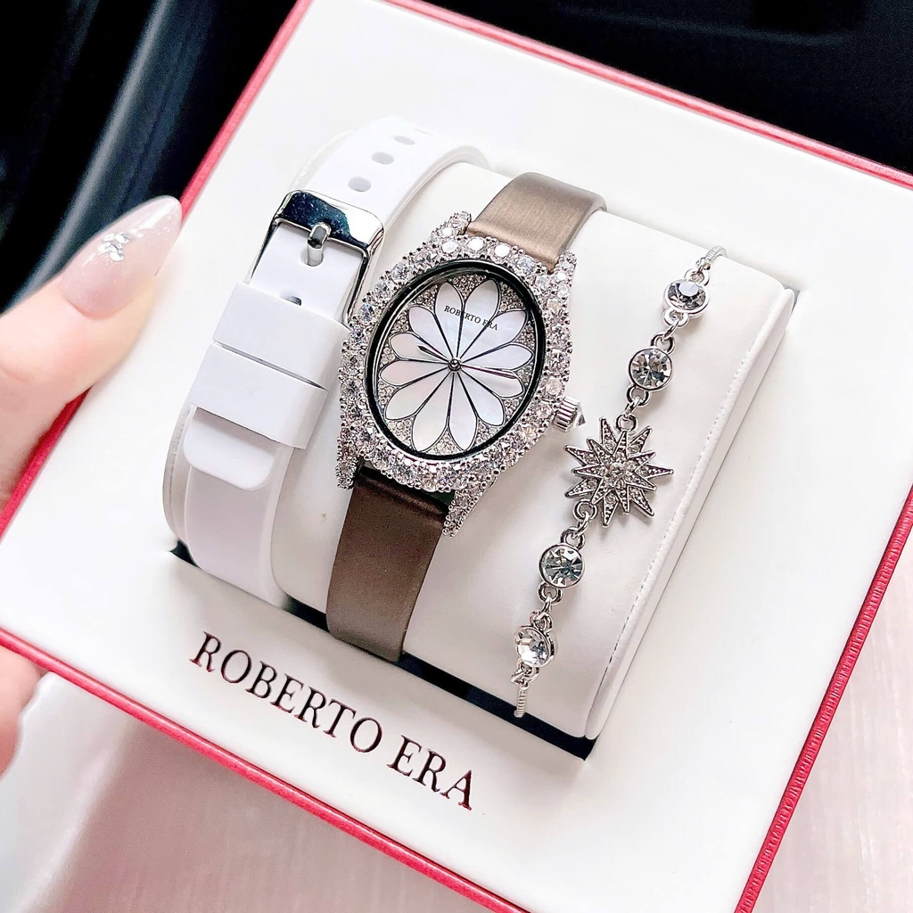 Set Đồng Hồ Nữ Roberto Era Dây Da Lụa Nâu Mặt Oval Họa Tiết 12 Cánh Hoa Size 33mm Viền Đá RE220 Tặng Kèm Bộ Dây Cao Su Trắng Và Vòng Tay
