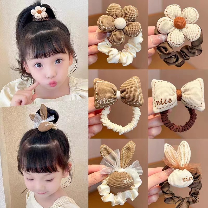 Cột tóc đính nơ hoa + tai thỏ (màu trà sữa) - kiểu 1