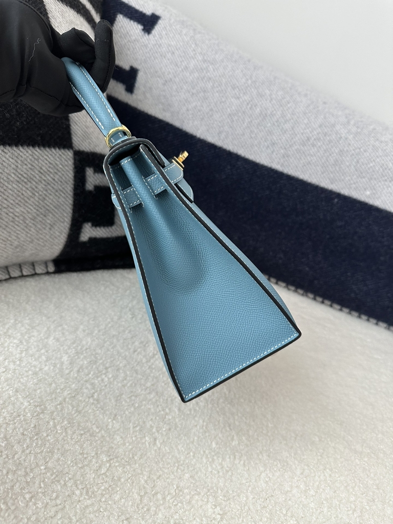 Kelly 25cm in imported Epsom grained leather, CC75 Blue Jean (denim blue) with gold hardware.