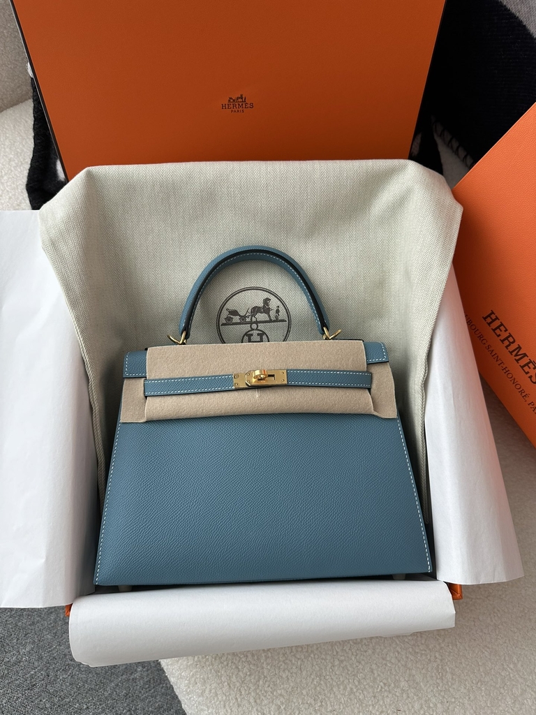 Kelly 25cm in imported Epsom grained leather, CC75 Blue Jean (denim blue) with gold hardware.