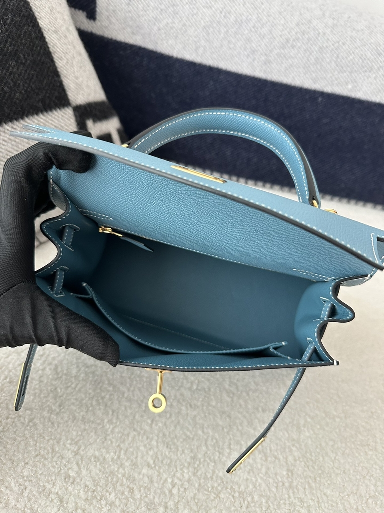 Kelly 25cm in imported Epsom grained leather, CC75 Blue Jean (denim blue) with gold hardware.