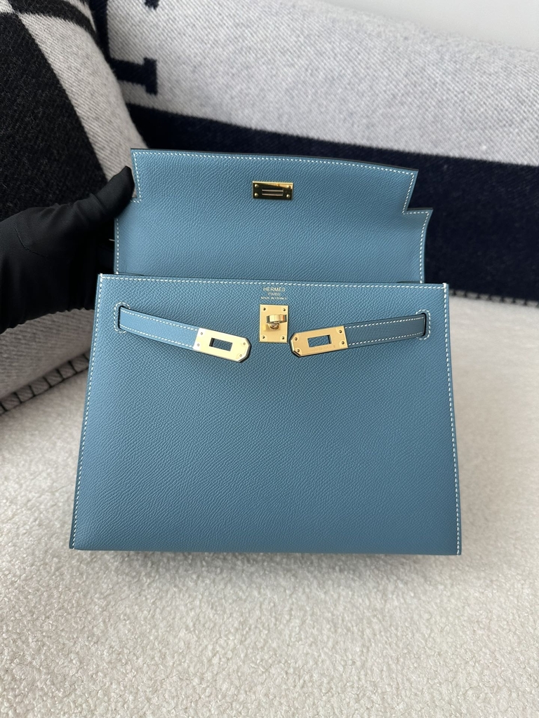 Kelly 25cm in imported Epsom grained leather, CC75 Blue Jean (denim blue) with gold hardware.