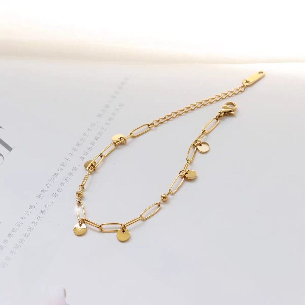 Vòng tay titan mạ vàng charm tròn 2501001