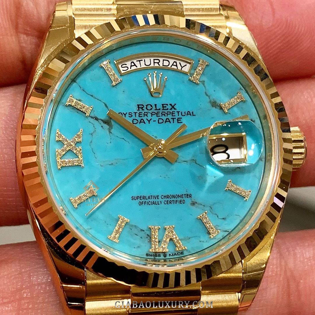 Đồng Hồ Rolex Day-Date 36 128238 Mặt Số Đá Ngọc Lam Cọc Số La Mã Nạm Kim Cương