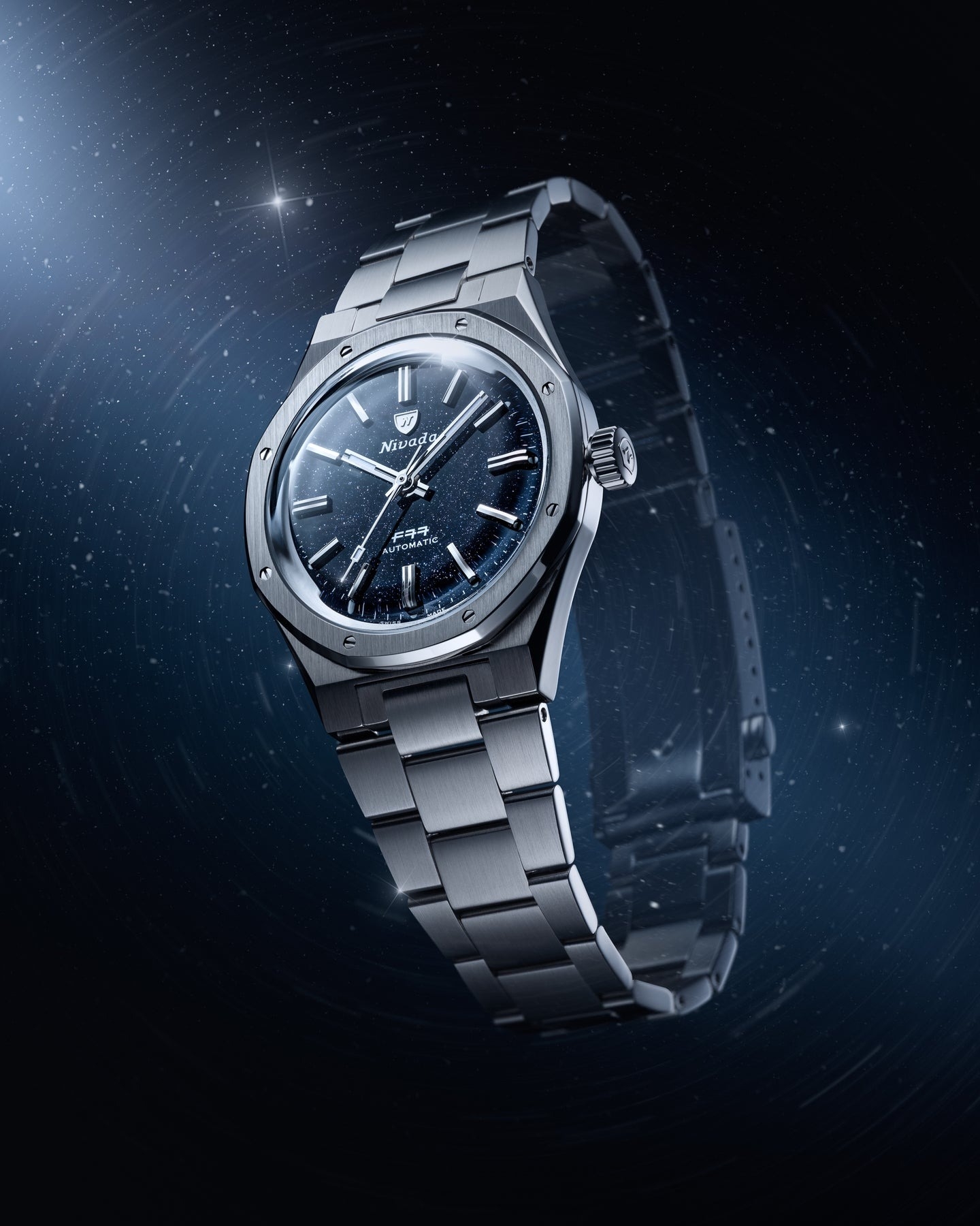 Nivada Grenchen, dòng sản phẩm F77, Ref number: 68010A77, mặt số đá thạch anh Aventurine xanh dương đậm