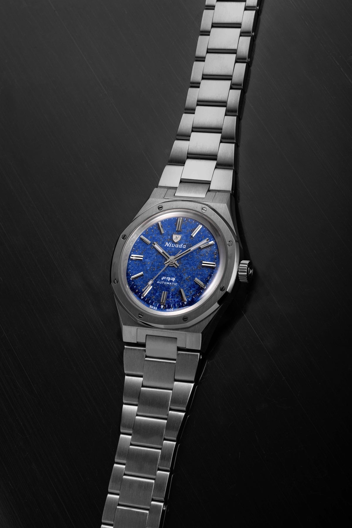 Nivada Grenchen, dòng sản phẩm F77, Ref number: 68017A77, mặt số Lapis Lazuli