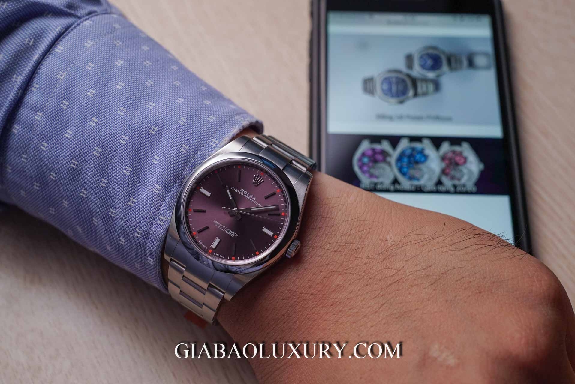 Đồng Hồ Rolex Oyster Perpetual 114300 Mặt Số Màu Nho Đỏ