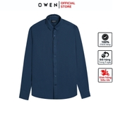 Áo Sơ Mi Nam Tay Dài Owen AR240610D màu xanh đậm trơn dáng suông regular fit tà lượn không túi chất liệu polyester
