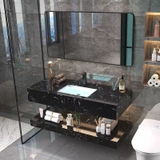 NT05 - Bàn đá 2 tầng đen vân mây kết hợp chậu sứ âm, vòi nóng lạnh và gương viền thép đen, kích thước 50x80cm.