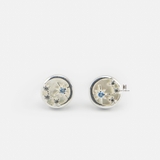 E STUD CIRCLE MOTHER OF PEARL AND STAR BLUE GEM