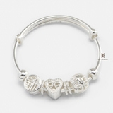 B BABY EXTENDABLE HEART BOW INSIDE AND CHIMING BALL