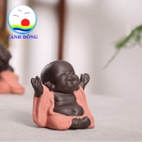 Tượng chú tiểu cười hoan hỷ dang tay đón hạnh phúc