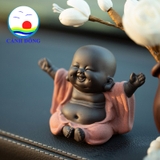 Tượng chú tiểu cười hoan hỷ dang tay đón hạnh phúc