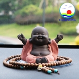 Tượng chú tiểu cười hoan hỷ dang tay đón hạnh phúc