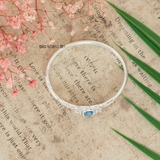 Vòng tay bé gái Mặt vòng hình 2 trái tim được gắn kết với nhau bởi viên đá xanh da trời V2409110005