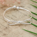 Vòng tay bạc cho bé gái mặt vòng hình nơ V2409110001