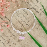 Vòng tay bé gái thiết kế charm nơ hồng xinh xắn V2409110026