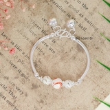 Vòng tay trẻ em charm cầu bạc và đá có chuông V2409110022