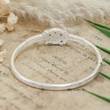 Vòng tay bạc mặt vòng hình hello kitty đính đá trắng đeo nơ đỏ