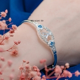 Vòng tay bạc nữ mặt vòng hình bầu dục đính đá kết hợp giữa hoa nhuỵ hoa đá xanh da trời và chứ LV hài hoà