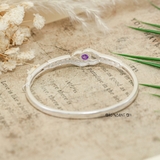 Vòng tay bạc cho nữ mặt vòng hình nơ lượn sóng đính đá trắng chính giữ đính đá tím nổi bật V2409040008