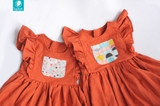 Váy linen cam phối ô nhí