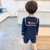 Bộ bơi dài tay màu đen, hình cún cam