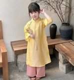 Áo dài lụa vàng nơ kèm cài tóc