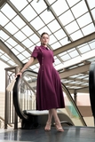 Đầm trên ôm dưới xòe cổ biến kiểu đính khuy trang trí