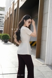 Áo thời trang ôm vừa cổ tròn tinh tế với nơ chiều dài chùm mông